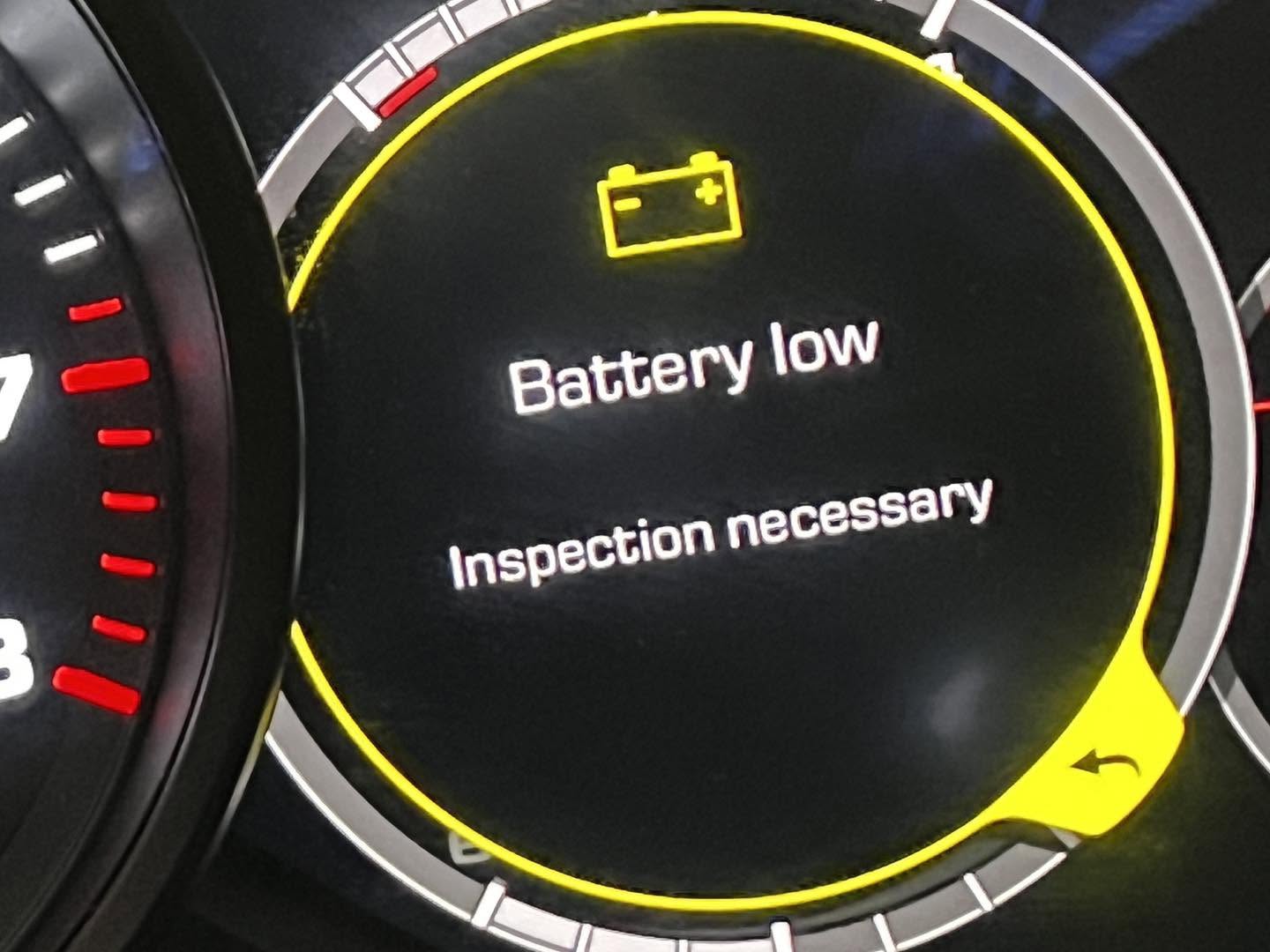 Porsche Cayenne dashboard battery low inspection necessary warning