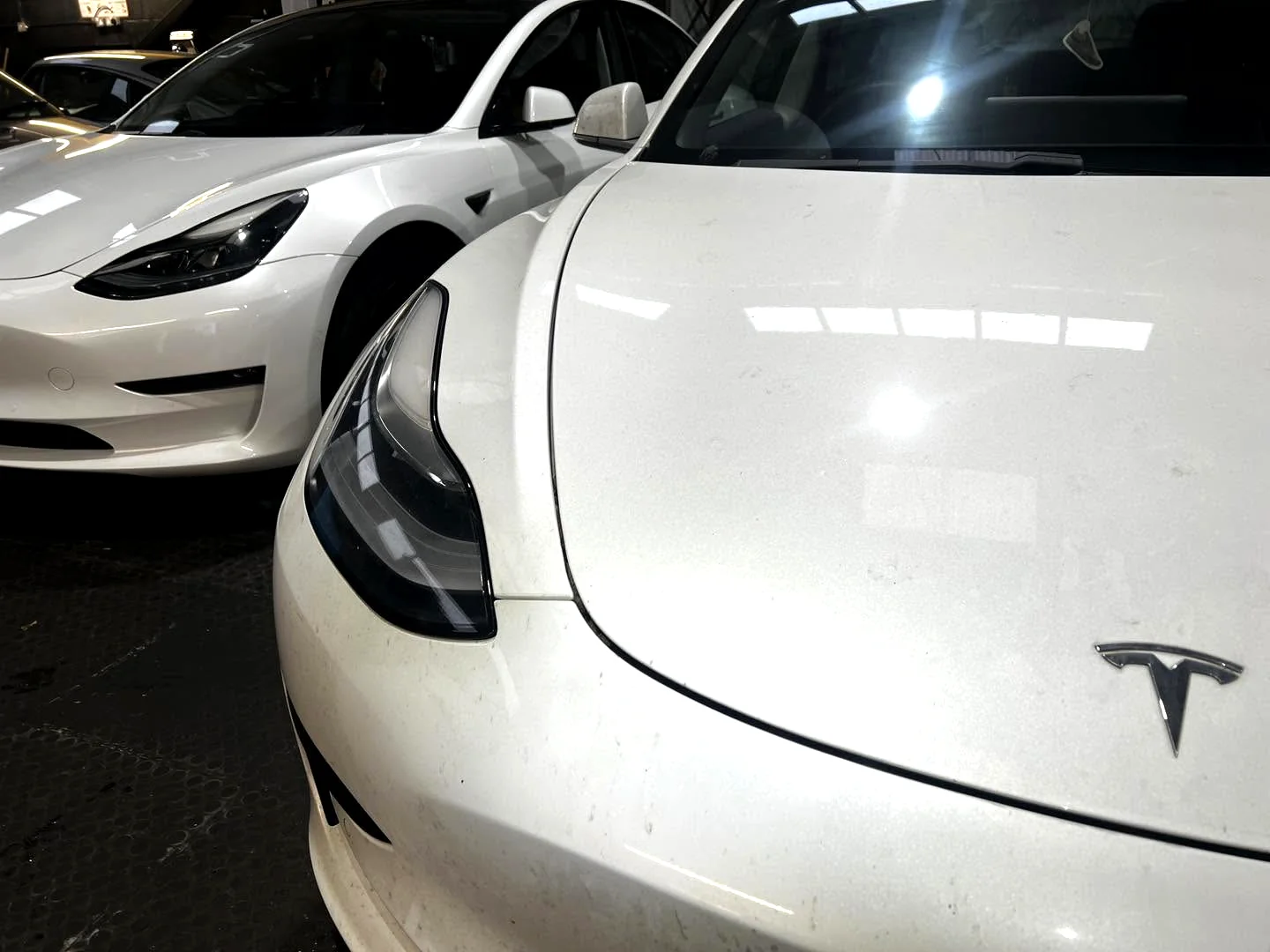 Two Tesla vehicles at SG Porsche Specialists workshop in Leicester